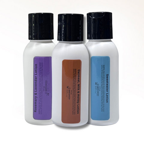 Three bottles of lotion with different colored labels on a white background